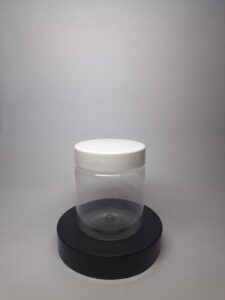 Transparent plastic jar with white lid for jars packaging, suitable for creams, hair masks, and cosmetic products. 